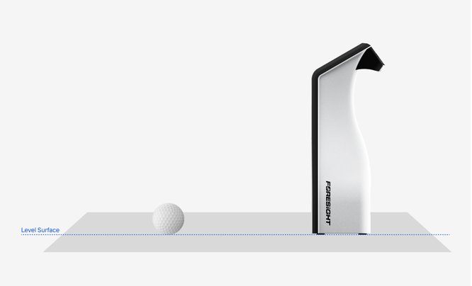 Side view showing correct GC2 setup. The GC2 stands upright on a level surface with its front (camera side) facing the golf ball. The ball sits on the same level surface a short distance in front of the device, not on a raised tee or mat edge. A dotted line labeled "Level Surface" shows that the GC2 and the ball rest at the same height.